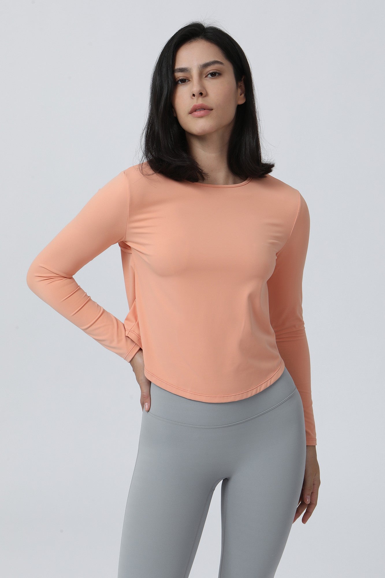 Long Sleeve Ruched Back Cutout Crop Top by bornfocus