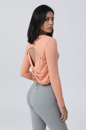 Long Sleeve Ruched Back Cutout Crop Top by bornfocus