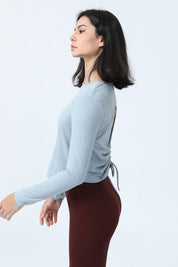 Long Sleeve Ruched Back Cutout Crop Top by bornfocus