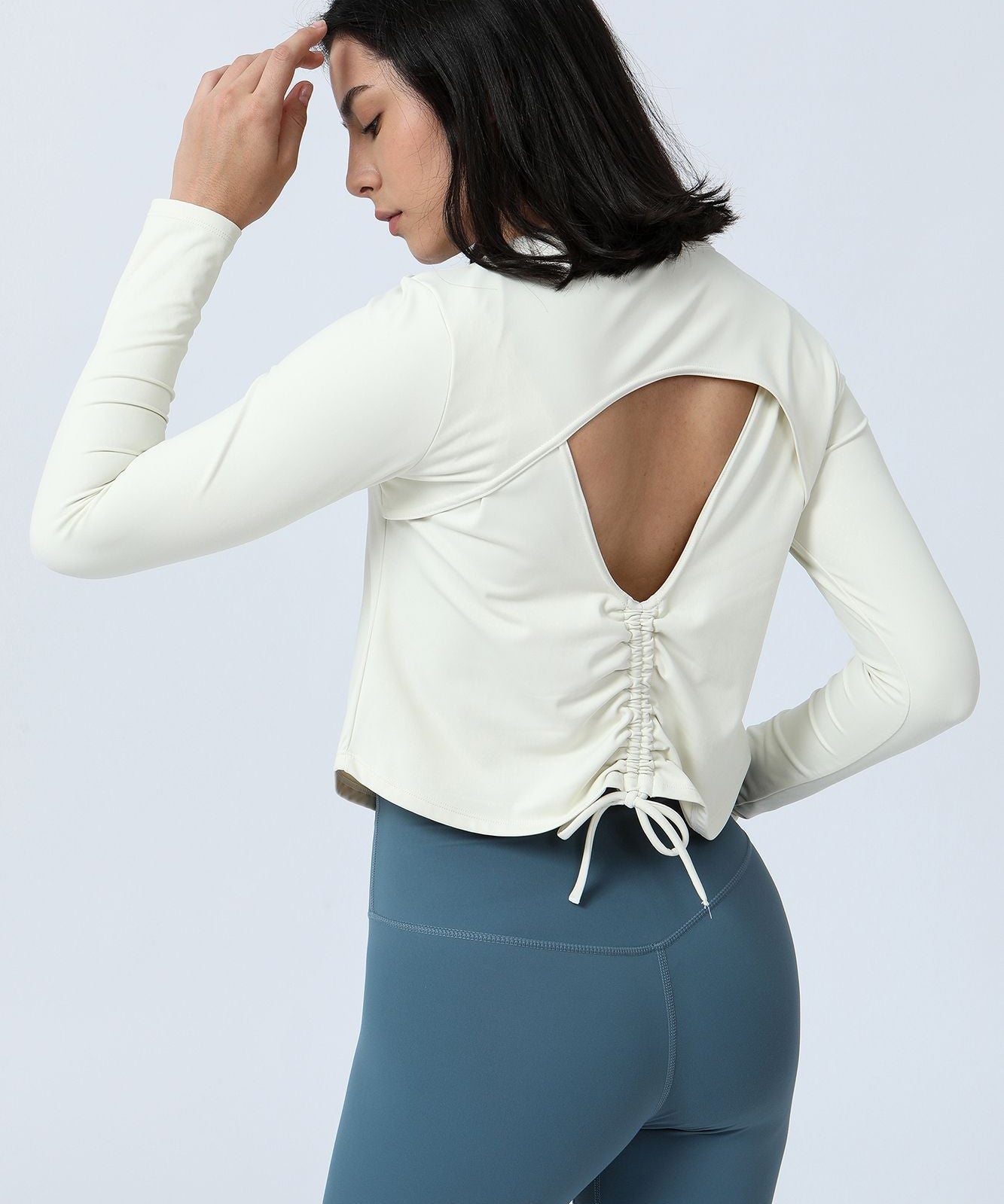 Long Sleeve Ruched Back Cutout Crop Top by bornfocus