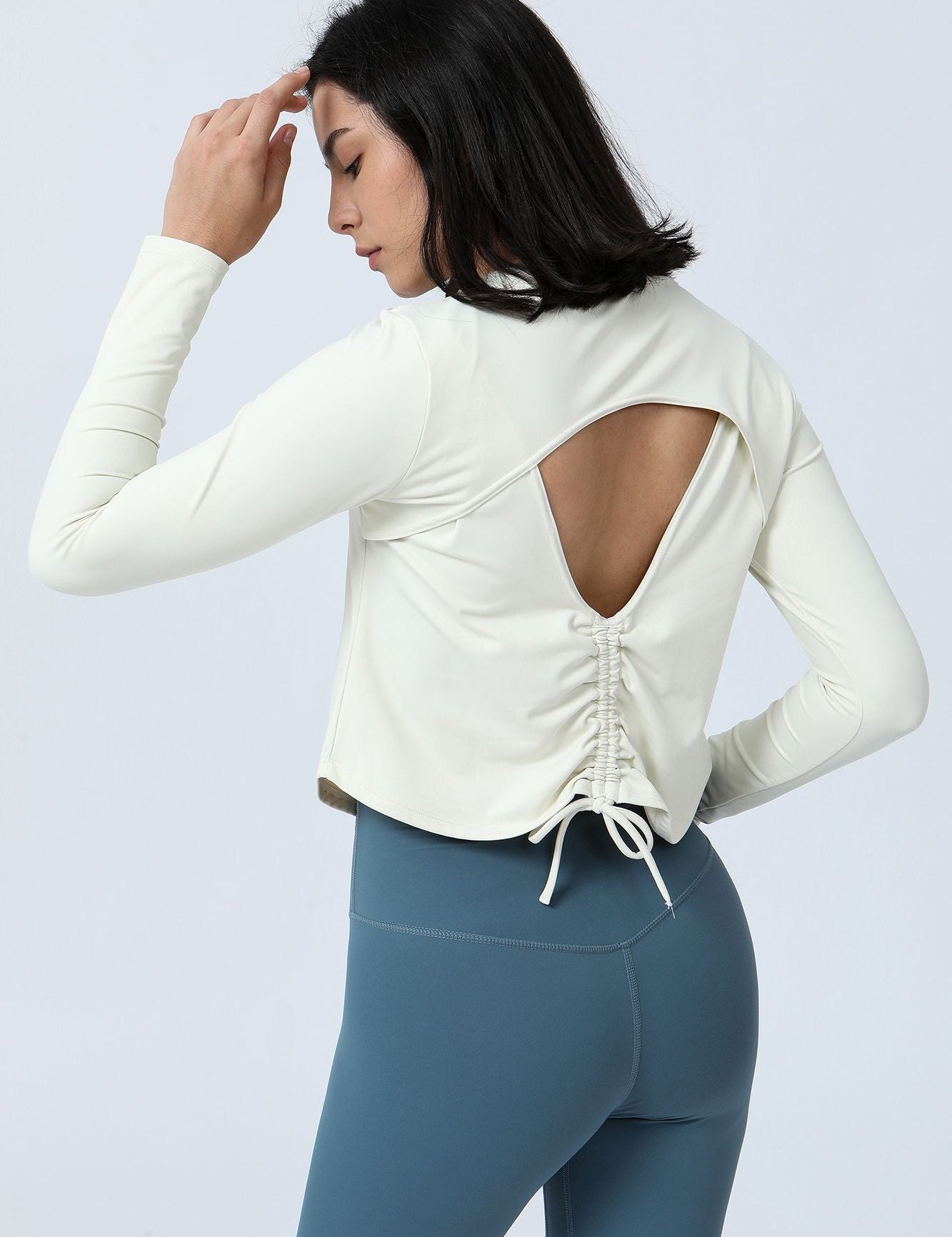 Long Sleeve Ruched Back Cutout Crop Top by bornfocus