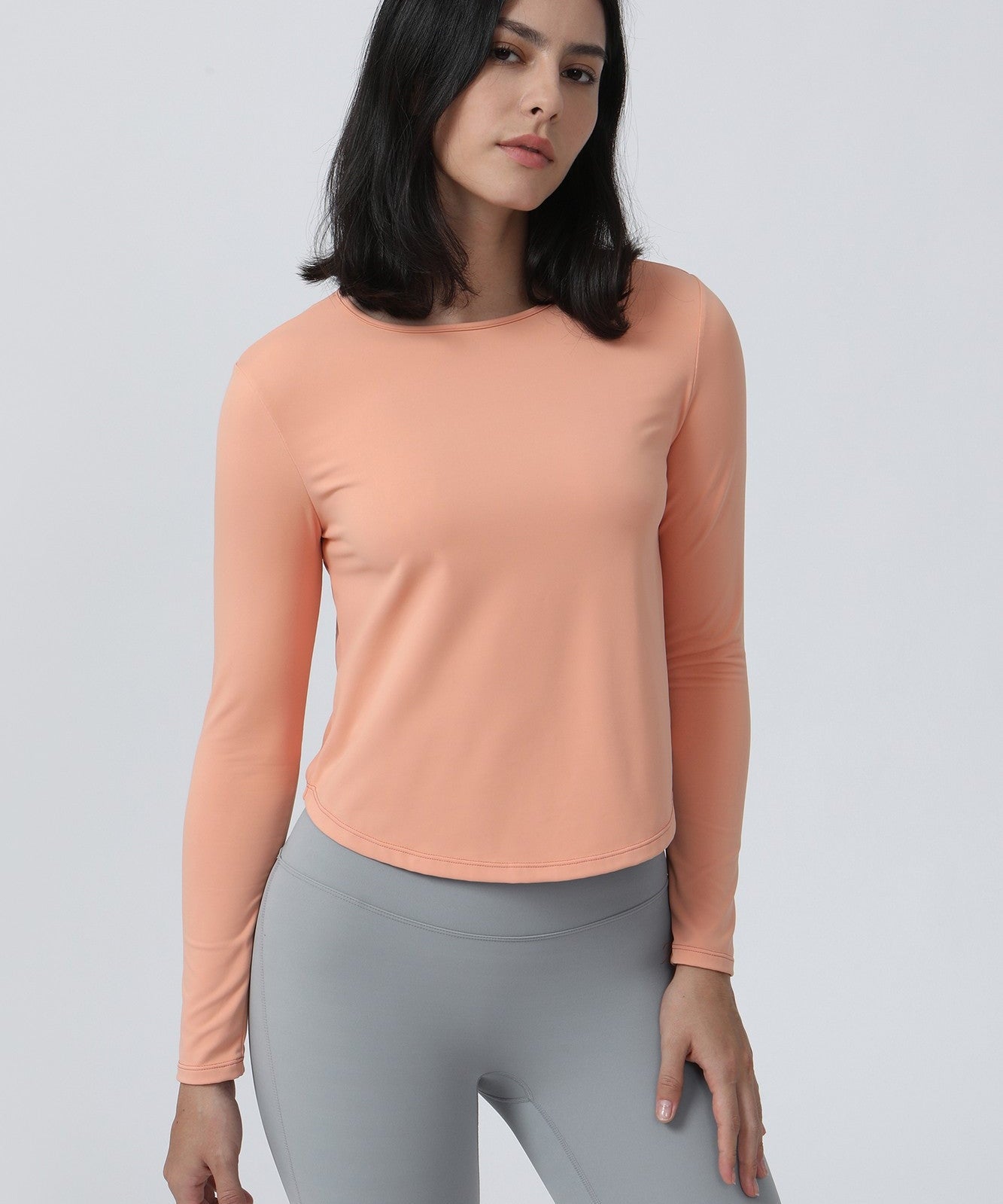 Long Sleeve Ruched Back Cutout Crop Top by bornfocus