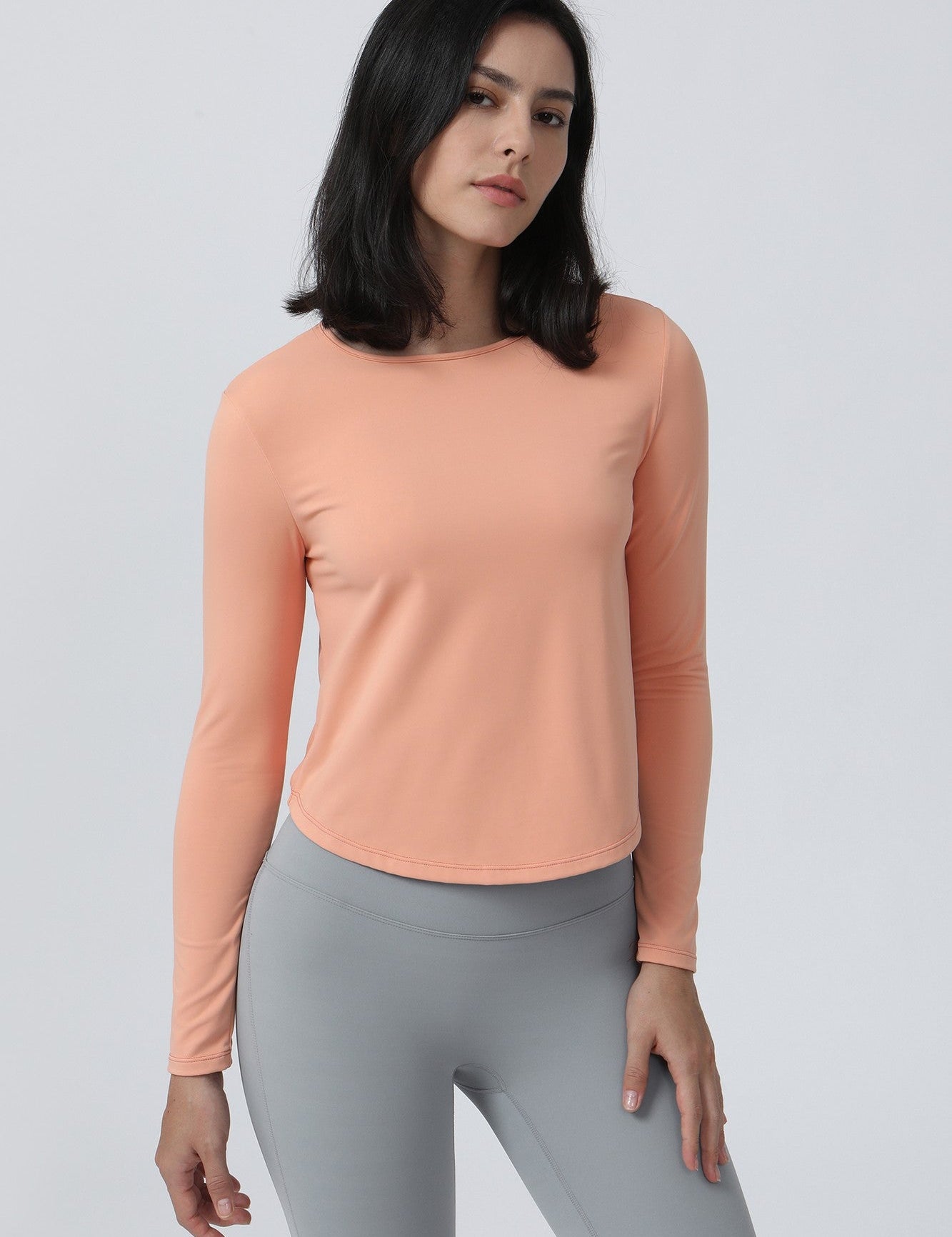 Long Sleeve Ruched Back Cutout Crop Top by bornfocus