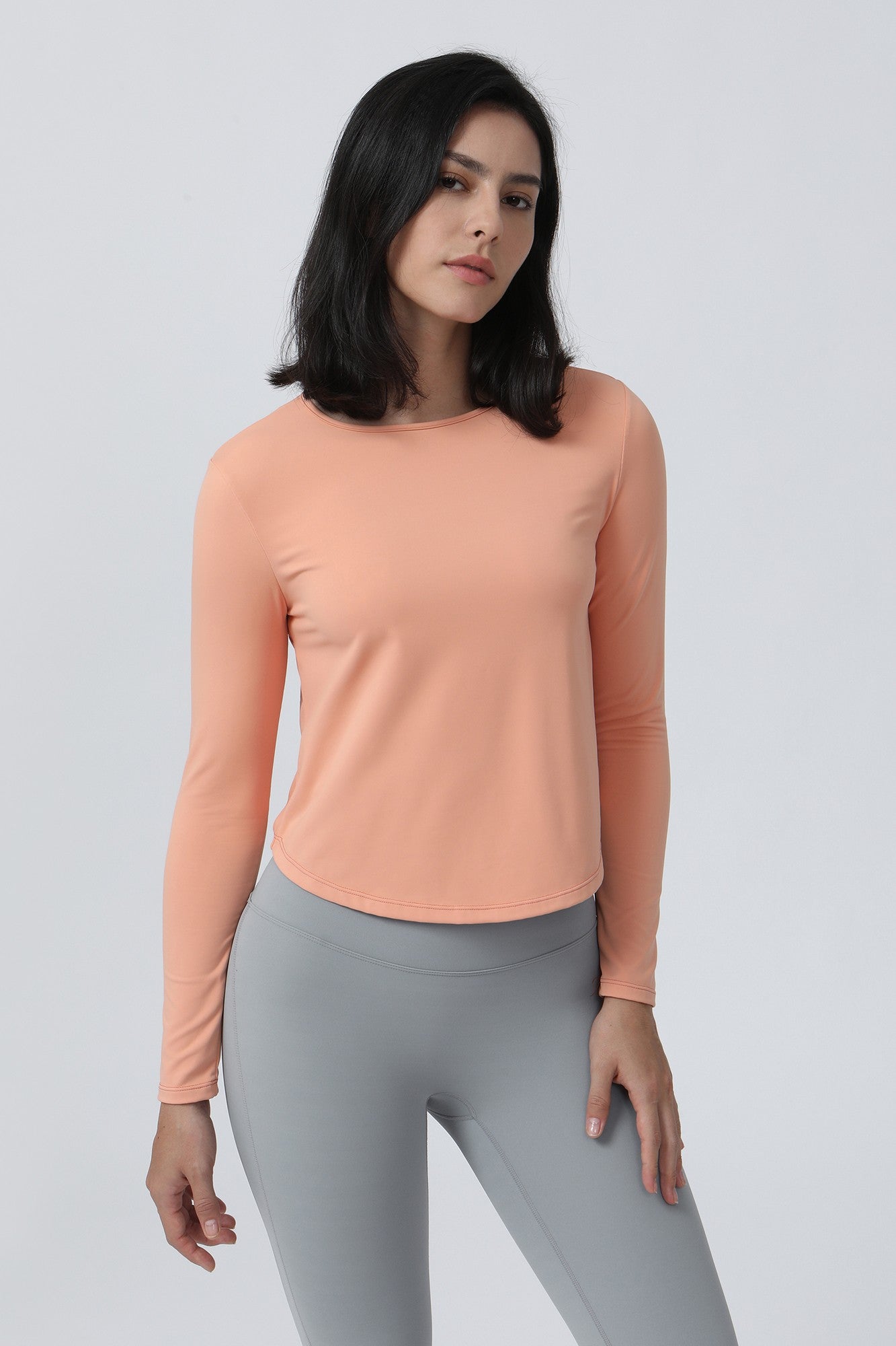 Long Sleeve Ruched Back Cutout Crop Top by bornfocus